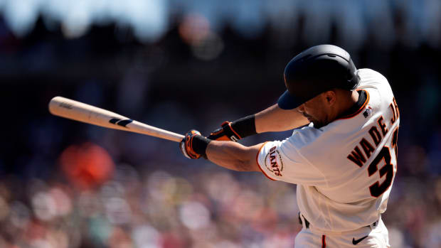 SF Giants first baseman LaMonte Wade Jr. connects with a pitch and sends it into right field. (2022)